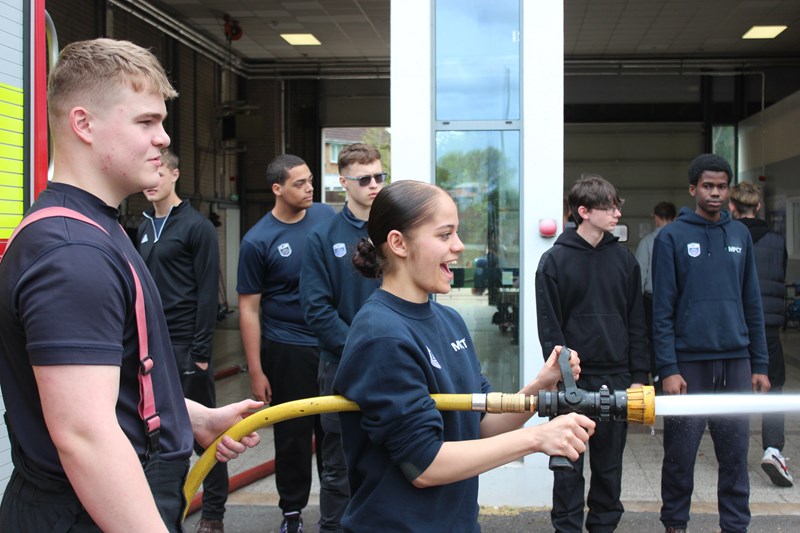 Firefighter with students