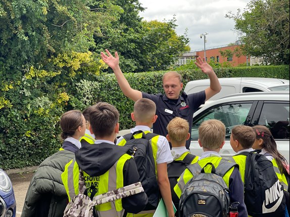 Firefighter with young people at Safety Zone