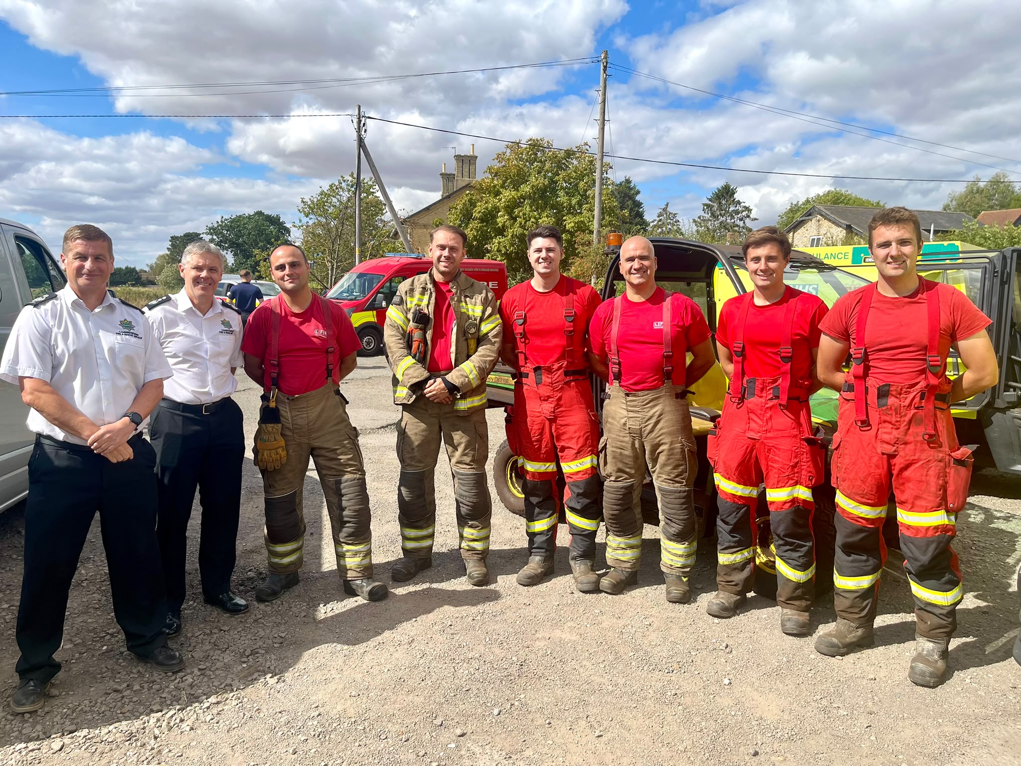 Deputy Chief Fire Officer Jon Anderson and Chief Fire Officer Matthew Warren standing with a national resilience crew.